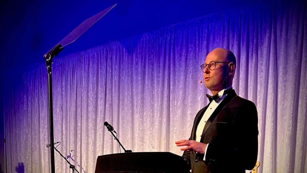 Speaker using conference prompter at event stage