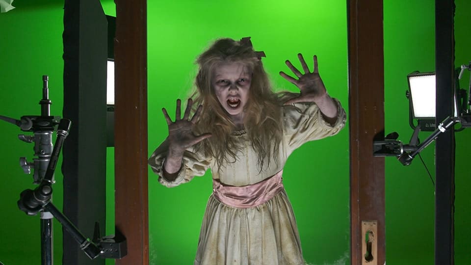 Ultimate Video Studio Lighting Guide 3 Scary girl posing on green screen set.