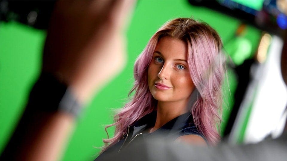 Portrait of a person with pink hair