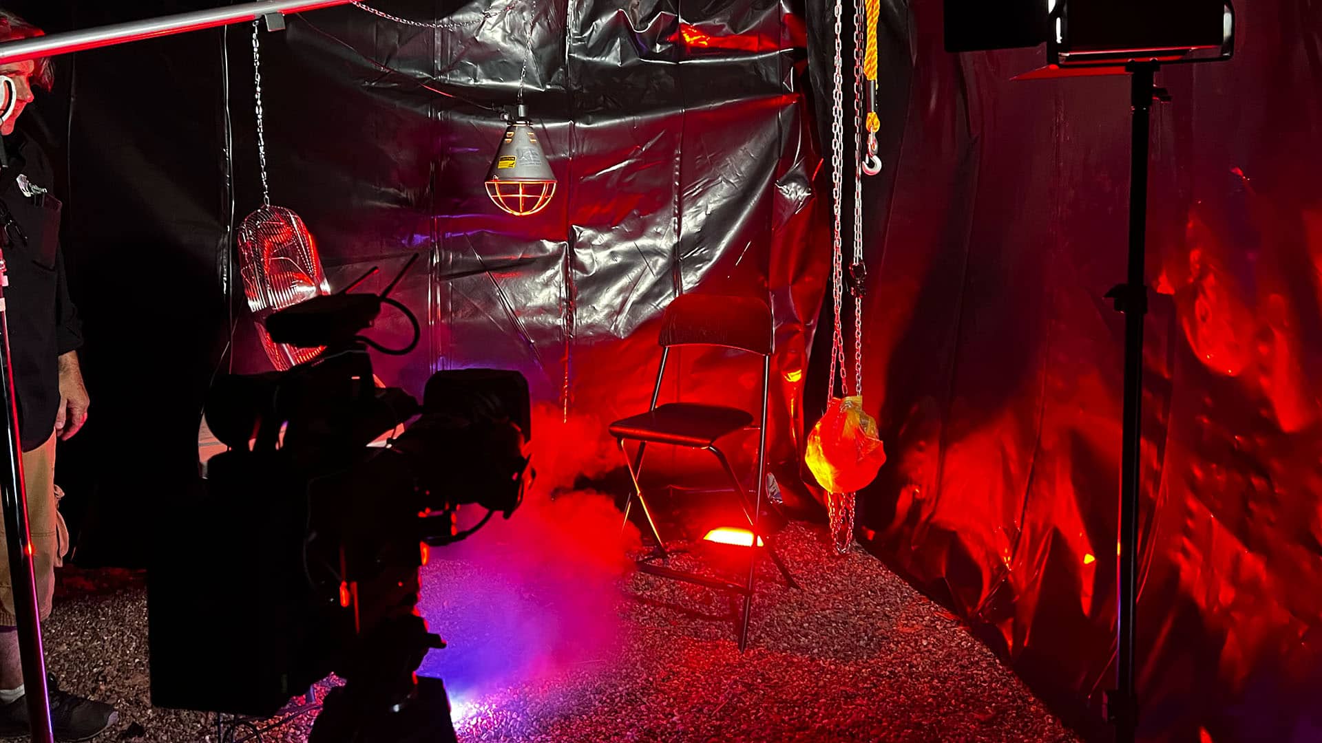 Spooky red-lit room with filming equipment for Manchester microdrama.