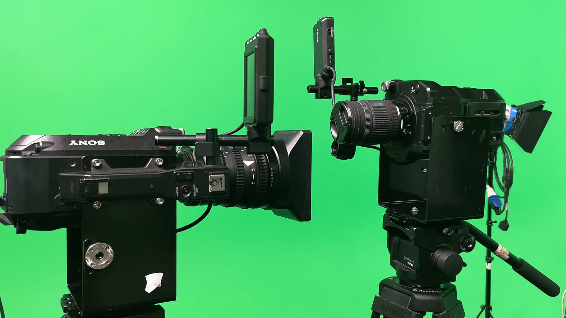 Vertical Film cameras set up against green screen