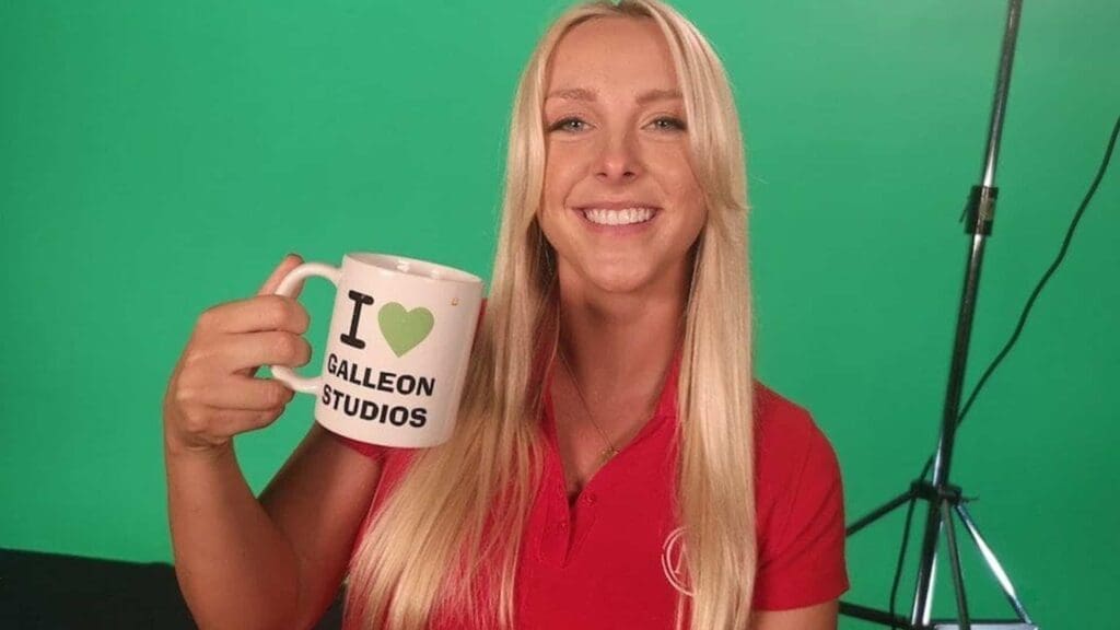 Smiling woman holding Galleon Studios mug