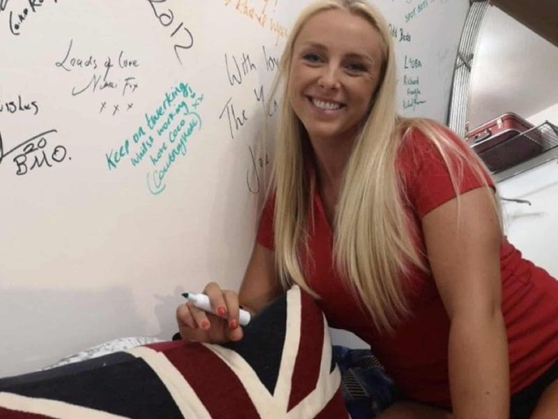 Cortney Veale signs the wall of fame copy