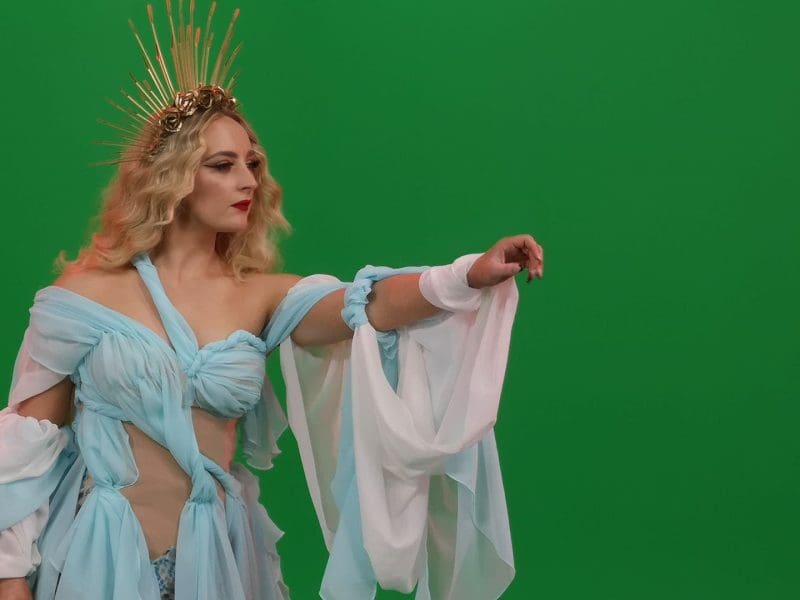 Woman in fantasy costume posing on greenscreen in infinity cove hire studio