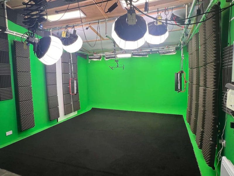 Soundproof green screen studio with professional lighting
