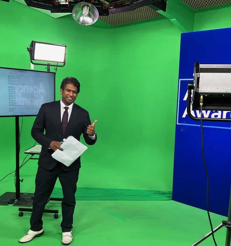 Man presenting an Awards Show in a professional green screen studio