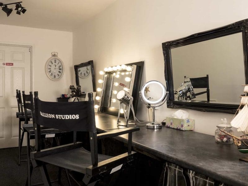 Makeup studio with mirrors and chairs setup